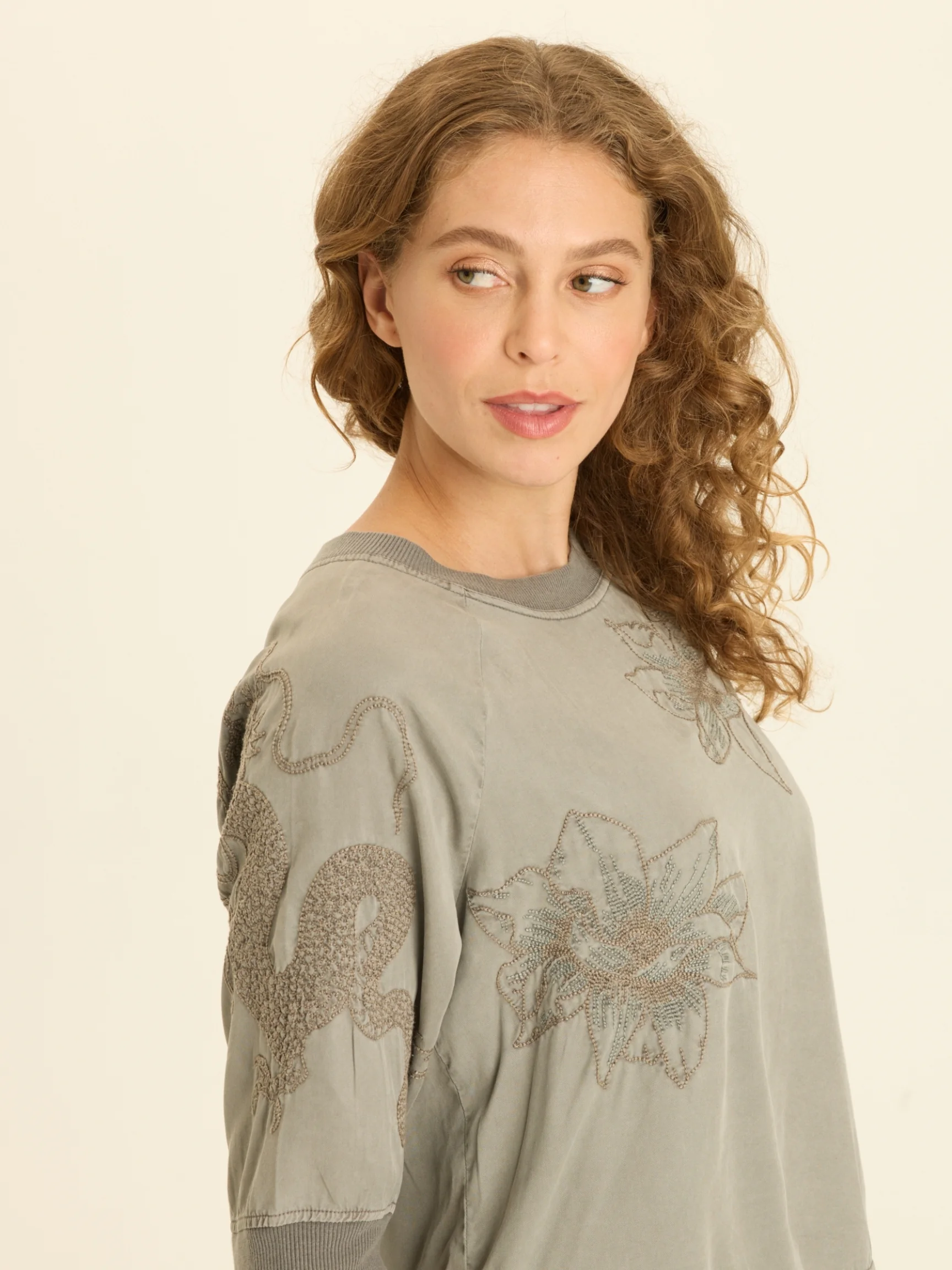 The model is wearing size XS