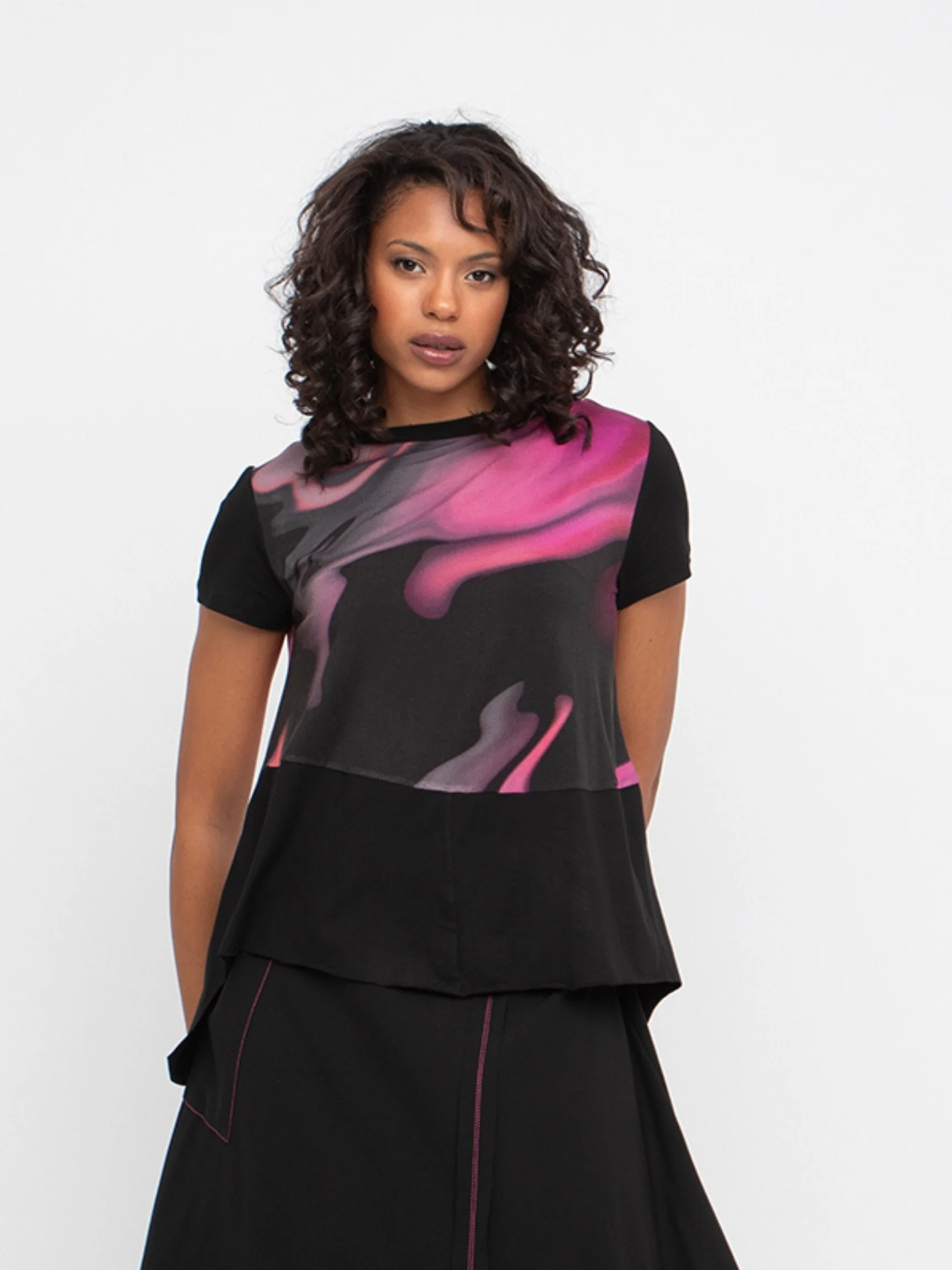 The model is wearing the top reversed.