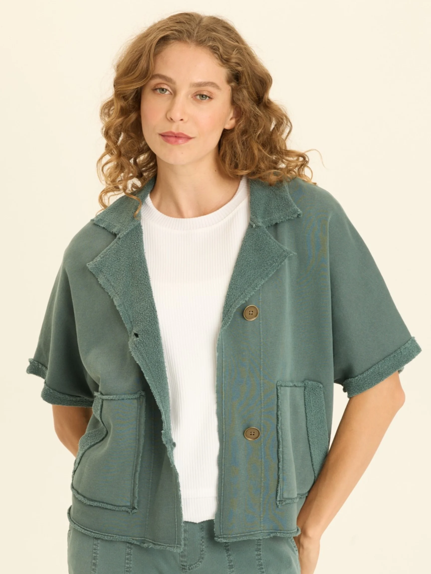 The model is wearing size XS